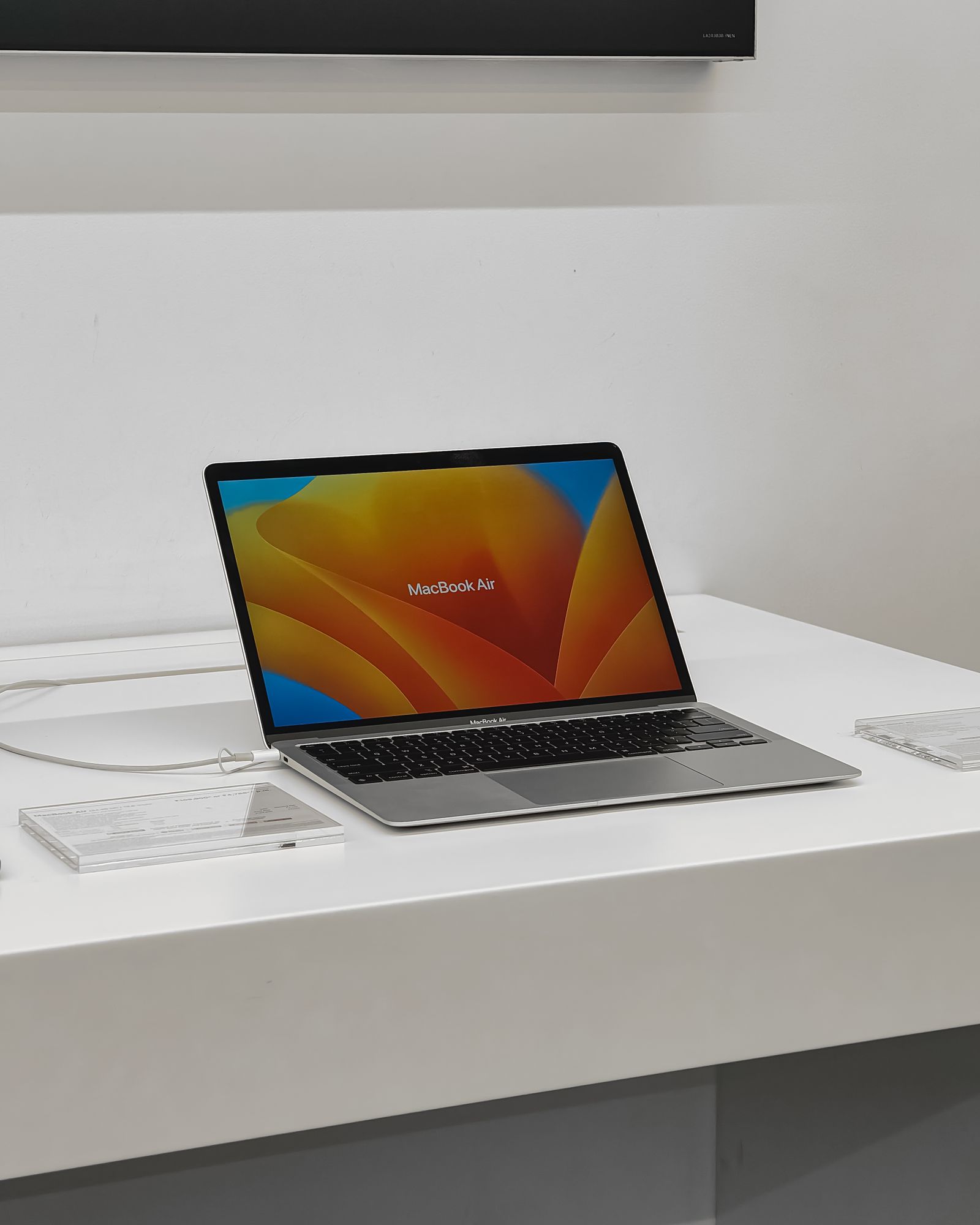 A MacBook Air on display in an electronics store